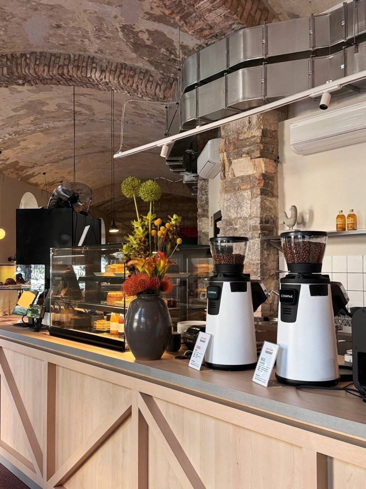 Bar counter with grinders and pastry display