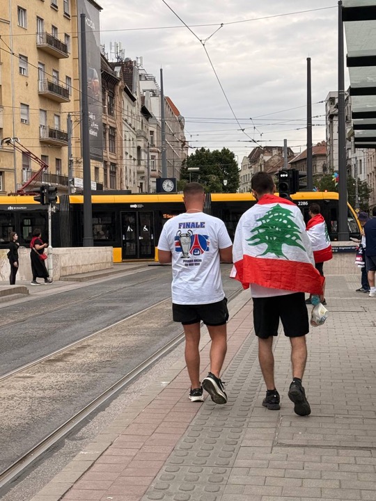 Fans with Champions League final gear walking through Budapest